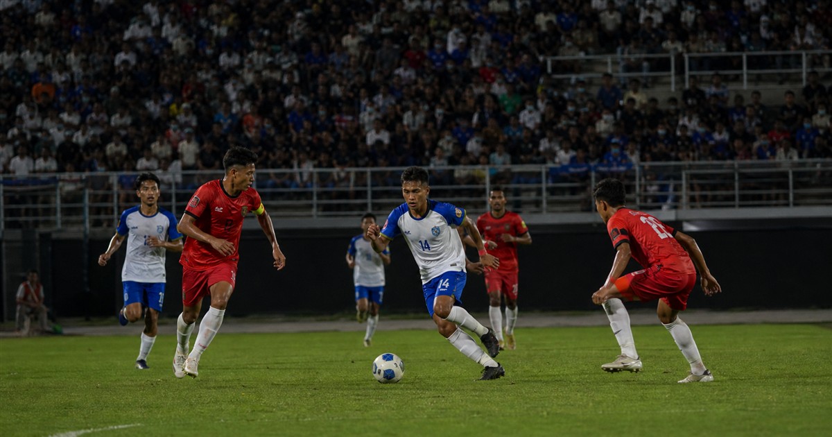 Cambodian Premier League players competing in a Phnom Penh stadium